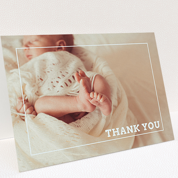 A new baby thank you card design named "Over Photo Frame". It is an A6 card in a landscape orientation. It is a photographic new baby thank you card with room for 1 photo. "Over Photo Frame" is available as a folded card, with mainly white colouring.