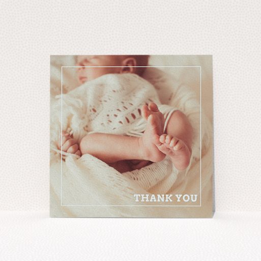 A new baby thank you card template titled "Over Photo Frame". It is a square (148mm x 148mm) card in a square orientation. It is a photographic new baby thank you card with room for 1 photo. "Over Photo Frame" is available as a flat card, with mainly white colouring.