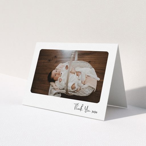 A new baby thank you card template titled 'Rounded Thanks'. It is an A5 card in a landscape orientation. It is a photographic new baby thank you card with room for 1 photo. 'Rounded Thanks' is available as a folded card, with mainly white colouring.