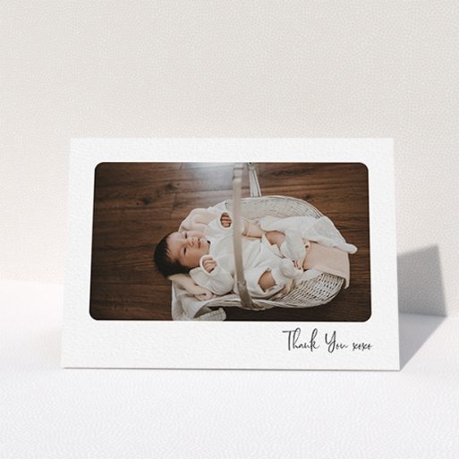 A new baby thank you card named "Rounded Thanks". It is an A6 card in a landscape orientation. It is a photographic new baby thank you card with room for 1 photo. "Rounded Thanks" is available as a folded card, with mainly white colouring.