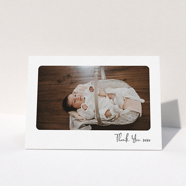 A new baby thank you card named "Rounded Thanks". It is an A6 card in a landscape orientation. It is a photographic new baby thank you card with room for 1 photo. "Rounded Thanks" is available as a folded card, with mainly white colouring.