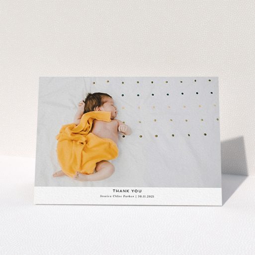 A new baby thank you card called "Sans Serif". It is an A6 card in a landscape orientation. It is a photographic new baby thank you card with room for 1 photo. "Sans Serif" is available as a folded card, with mainly white colouring.