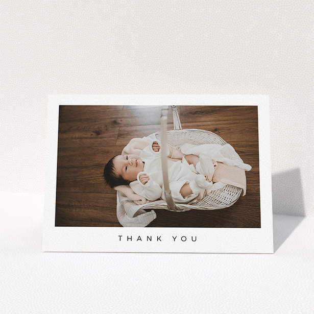 A new baby thank you card called "Simple". It is an A5 card in a landscape orientation. It is a photographic new baby thank you card with room for 1 photo. "Simple" is available as a folded card, with mainly white colouring.