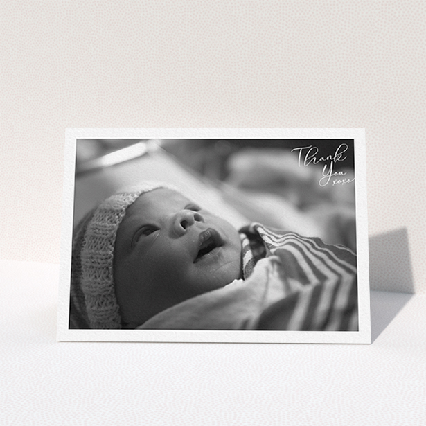 A new baby thank you card design named "Simple Landscape Thanks". It is an A6 card in a landscape orientation. It is a photographic new baby thank you card with room for 1 photo. "Simple Landscape Thanks" is available as a folded card, with mainly white colouring.