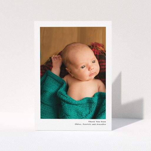 A new baby thank you card template titled "Simple Portrait". It is an A5 card in a portrait orientation. It is a photographic new baby thank you card with room for 1 photo. "Simple Portrait" is available as a folded card, with mainly white colouring.