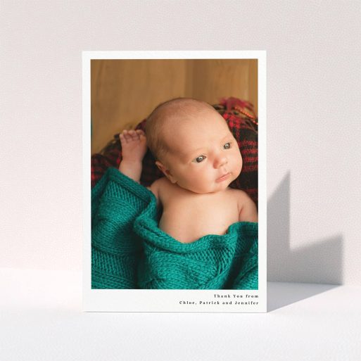A new baby thank you card design named "Simple Portrait". It is an A6 card in a portrait orientation. It is a photographic new baby thank you card with room for 1 photo. "Simple Portrait" is available as a folded card, with mainly white colouring.