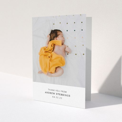 A new baby thank you card design named 'Simple, Portrait Thank You'. It is an A5 card in a portrait orientation. It is a photographic new baby thank you card with room for 1 photo. 'Simple, Portrait Thank You' is available as a folded card, with mainly white colouring.