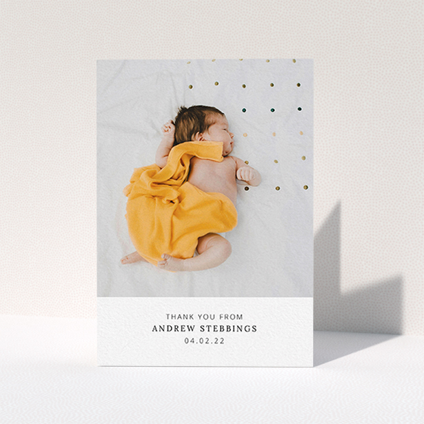 A new baby thank you card named "Simple, Portrait Thank You". It is an A6 card in a portrait orientation. It is a photographic new baby thank you card with room for 1 photo. "Simple, Portrait Thank You" is available as a folded card, with mainly white colouring.