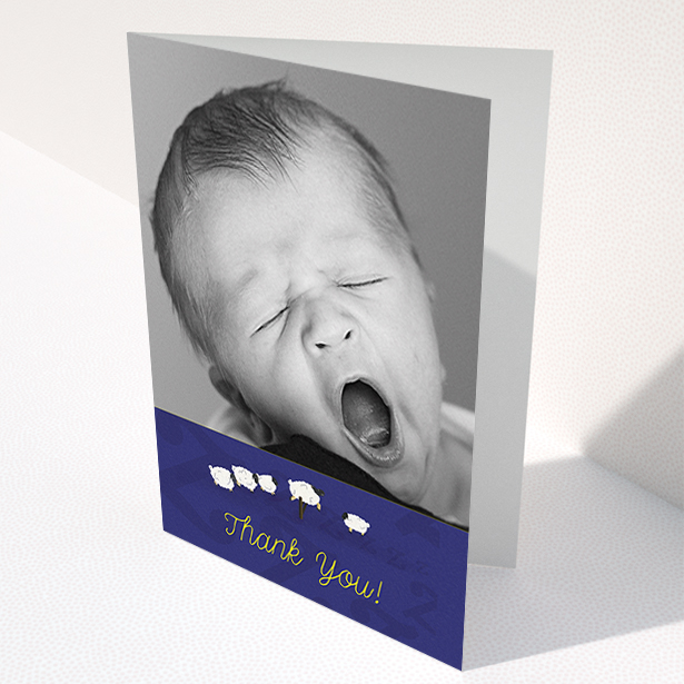 A new baby thank you card called "Sleepy Time". It is an A6 card in a portrait orientation. It is a photographic new baby thank you card with room for 1 photo. "Sleepy Time" is available as a folded card, with tones of navy blue and white.