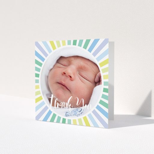A new baby thank you card design called 'Sun Centre'. It is a square (148mm x 148mm) card in a square orientation. It is a photographic new baby thank you card with room for 1 photo. 'Sun Centre' is available as a folded card, with mainly light blue colouring.