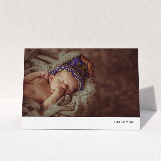 A new baby thank you card design named "Thankful with Simplicity". It is an A6 card in a landscape orientation. It is a photographic new baby thank you card with room for 1 photo. "Thankful with Simplicity" is available as a folded card, with mainly white colouring.