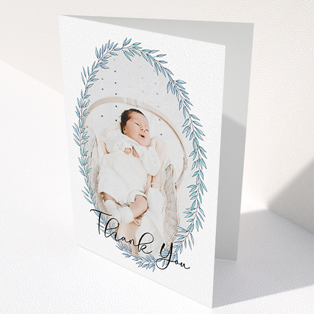 A new baby thank you card called "Tussled Wreath". It is an A6 card in a portrait orientation. It is a photographic new baby thank you card with room for 1 photo. "Tussled Wreath" is available as a folded card, with tones of blue and white.