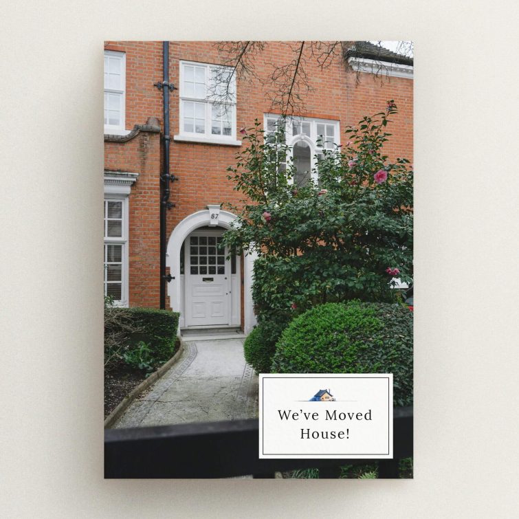 Change of address card featuring a house exterior and one decorative photo.