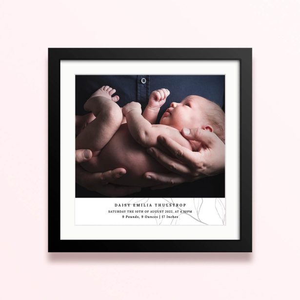 Framed and mounted photo print design featuring one photograph of a newborn baby.