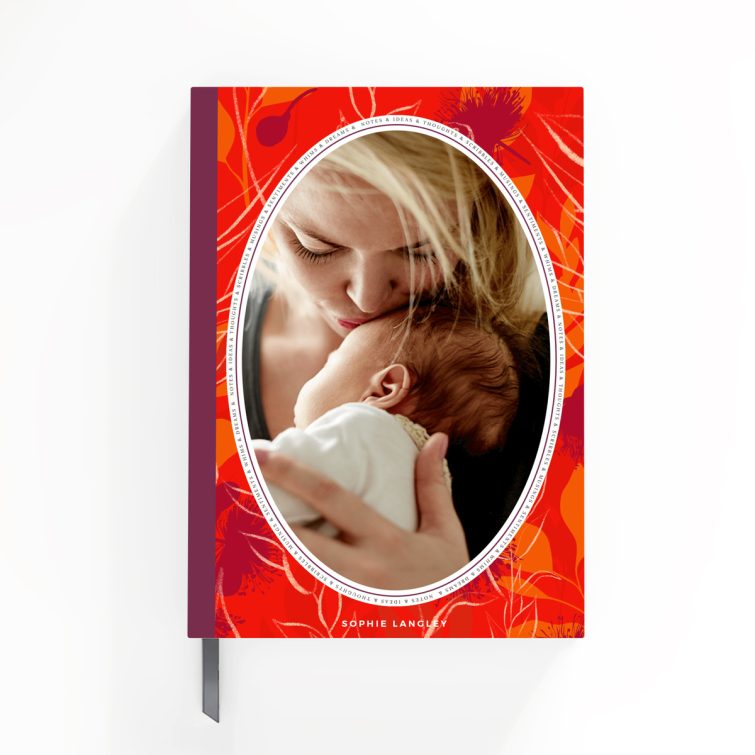 Floral notebook cover design with red and orange patterns, featuring one photo on front cover; personalised by Utterly Printable.