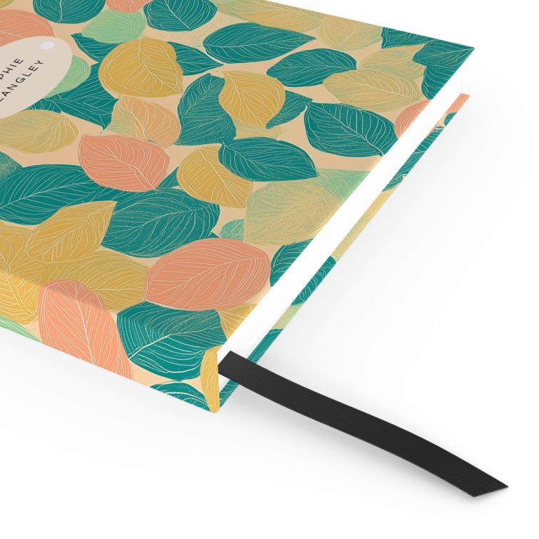 Colourful leaf-patterned notebook design with one photo placeholder and personalised name by Utterly Printable.