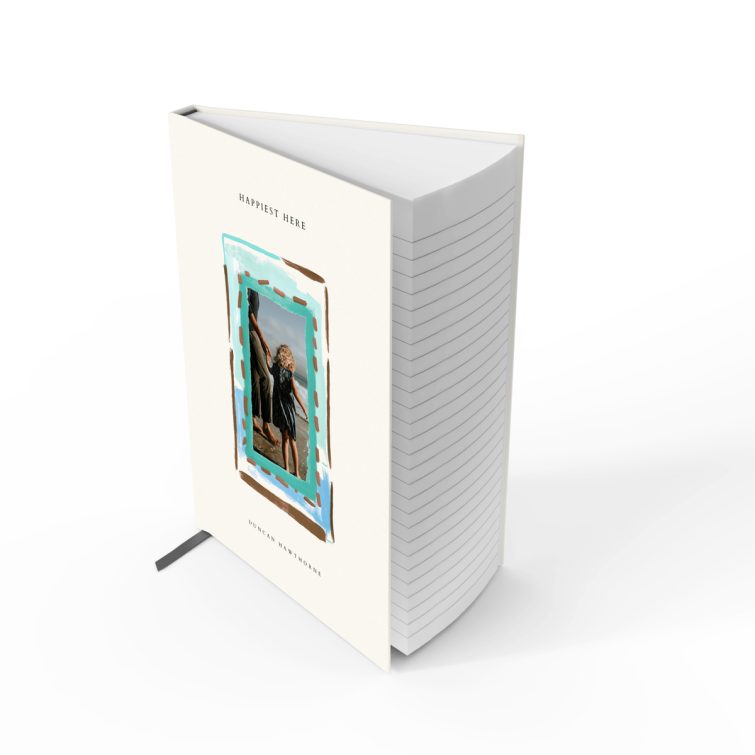 Elegant portrait notebook design with a playful painted border on the cover, featuring one photo.