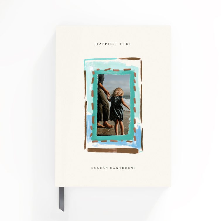 Elegant portrait notebook design with a playful painted border on the cover, featuring one photo.