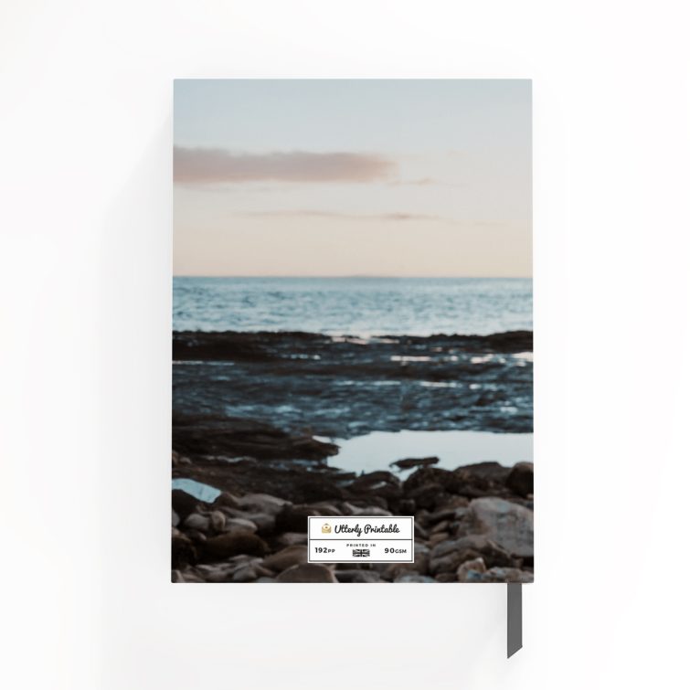 Portrait orientation notebook cover design with one photo by the ocean, personalised by Utterly Printable.