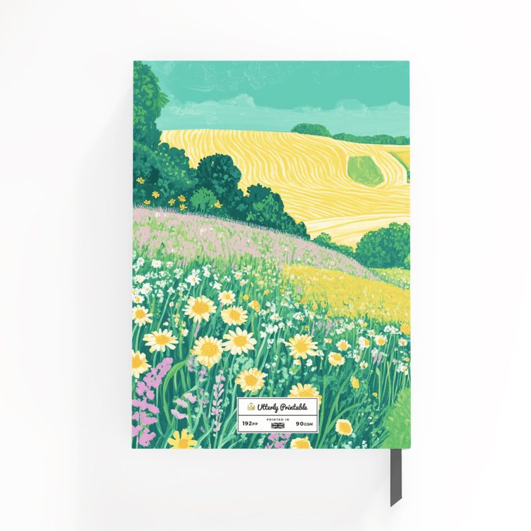 Colourful countryside landscape design on notebook cover with floral patterns, ideal for personalised gifts; includes one image.