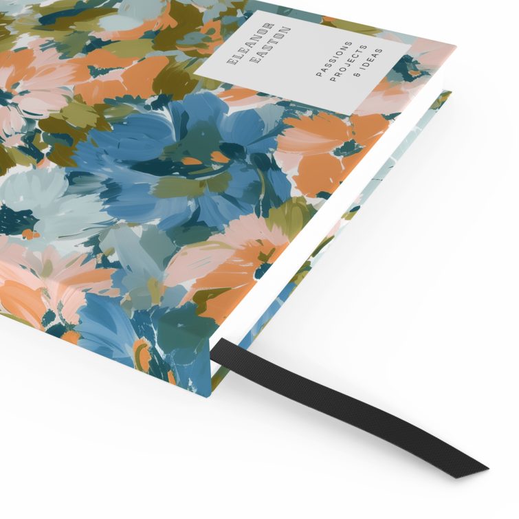 Floral pattern notebook design with abstract flowers covering the front and back spread.