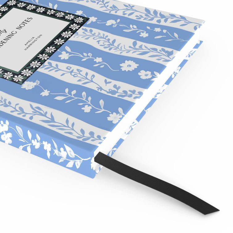 Floral design gardening notes notebook with one placeholder photo on the cover, featuring blue and white botanical pattern.