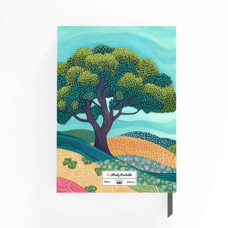 Illustrated notebook design with colourful landscape and two stylised trees, featuring Utterly Printable branding on the cover.