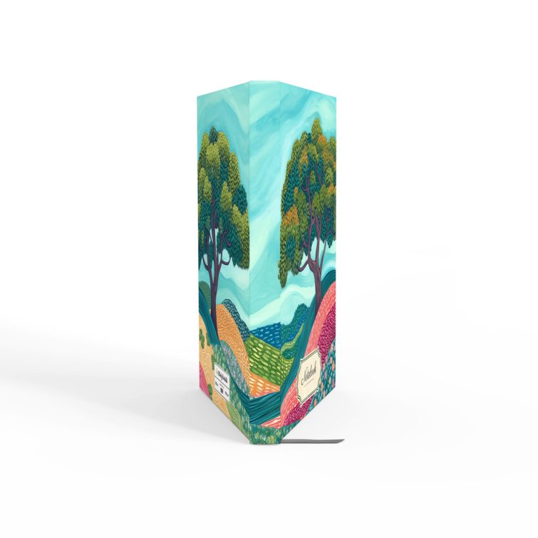 Illustrated notebook design with colourful landscape and two stylised trees, featuring Utterly Printable branding on the cover.