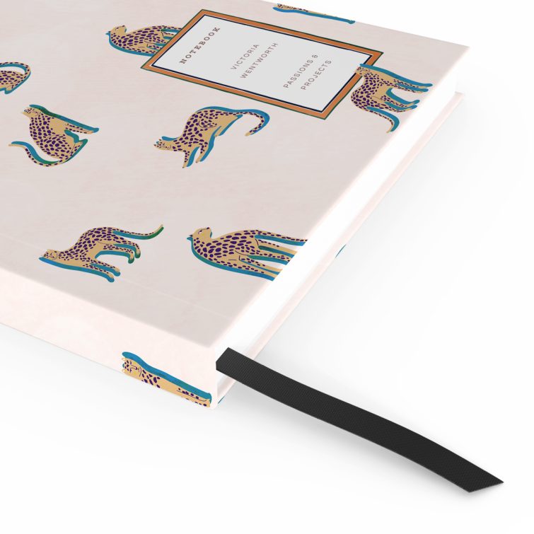 Colourful cheetah pattern notebook design with no photos on the cover spread.