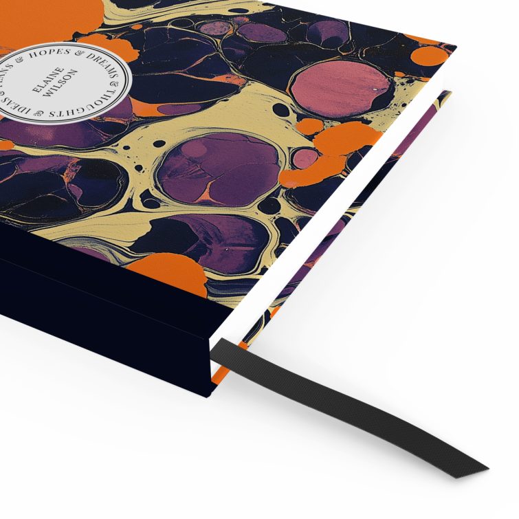 Abstract marbled design notebook cover with vibrant orange and purple patterns, featuring one photo placeholder on the front cover.