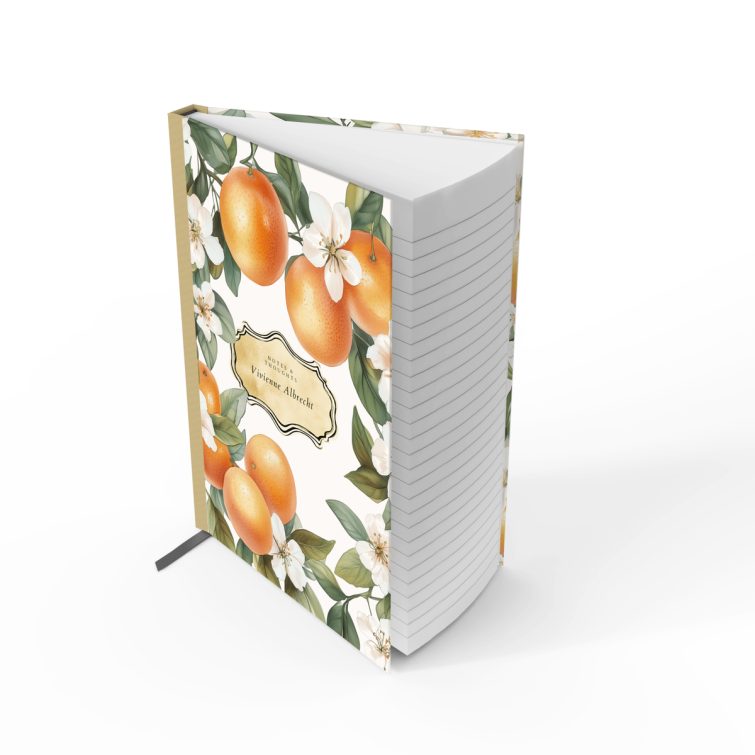 Floral and citrus-themed portrait notebook cover design with orange and white blossoms, featuring three decorative photos.