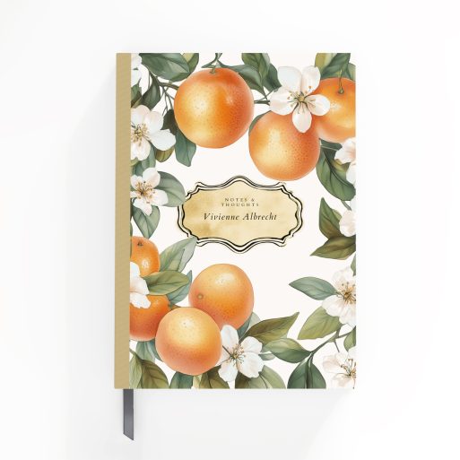 Floral and citrus-themed portrait notebook cover design with orange and white blossoms, featuring three decorative photos.