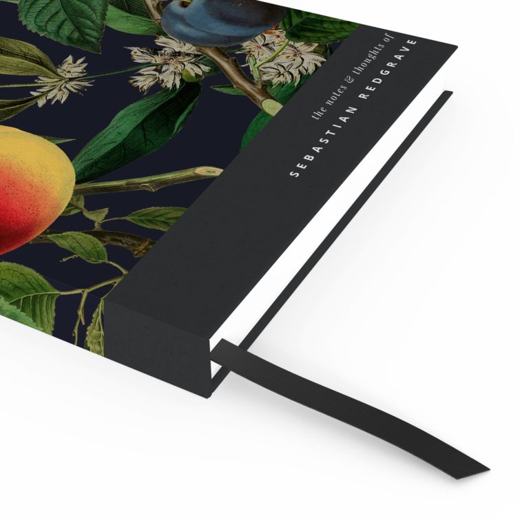 Colourful botanical design notebook with vibrant fruit illustrations on the cover, featuring one photo placeholder on the back cover.