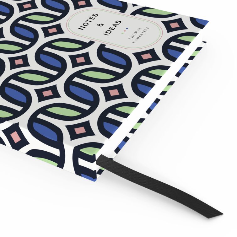 Colourful geometric patterned notebooks design with one placeholder photo on a portrait-oriented cover spread by Utterly Printable.