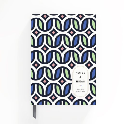 Colourful geometric patterned notebooks design with one placeholder photo on a portrait-oriented cover spread by Utterly Printable.