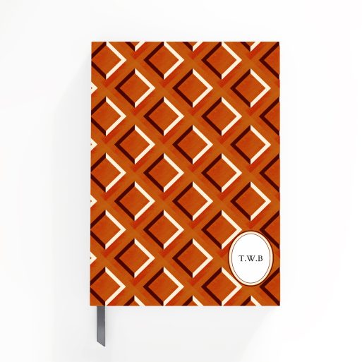 Geometric patterned notebook cover design with classic red and orange diamond shapes suitable for personalised printing, featuring one placeholder photo spot.