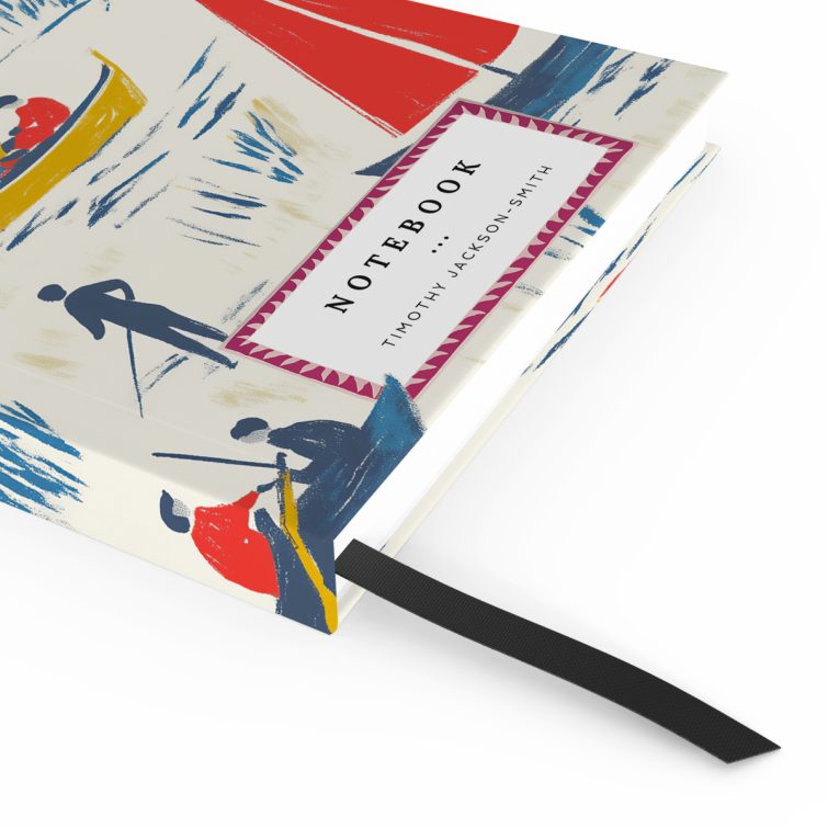 Colourful illustrated notebook cover design featuring boats and figures, including one placeholder photo.