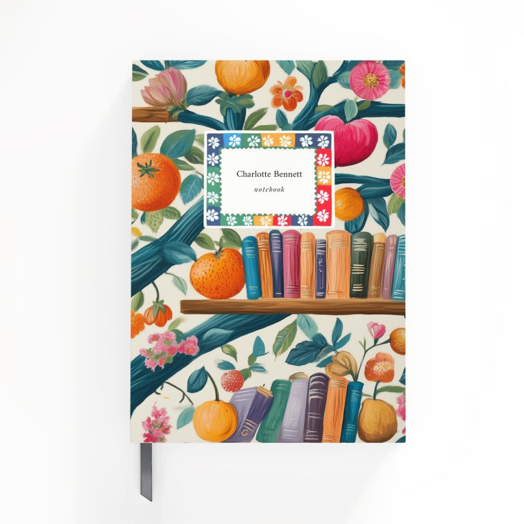 Colourful floral and fruit-themed notebook cover design with books on shelves, featuring one photo placeholder.