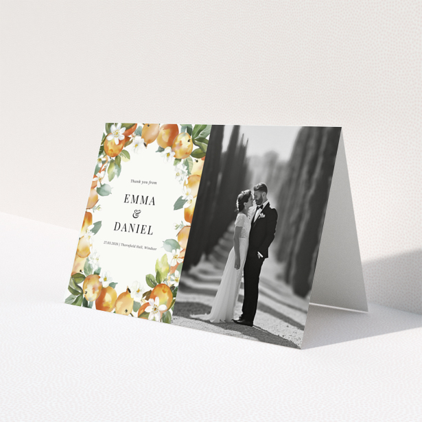 Wedding thank you card with floral design and one black and white wedding photo.