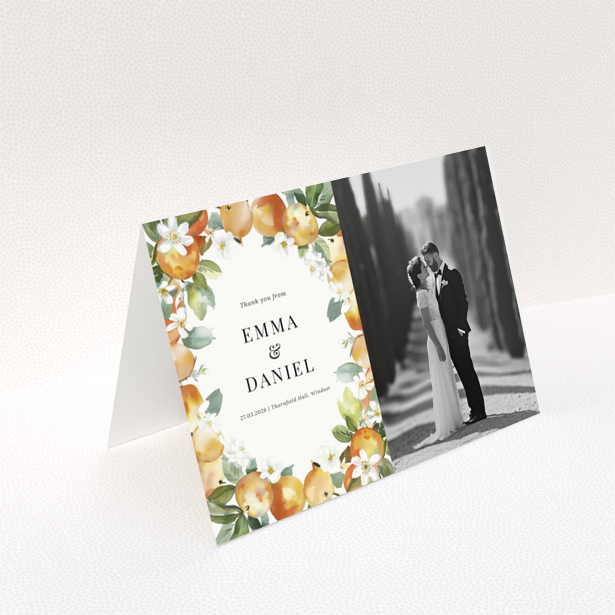 Wedding thank you card with floral design and one black and white wedding photo.