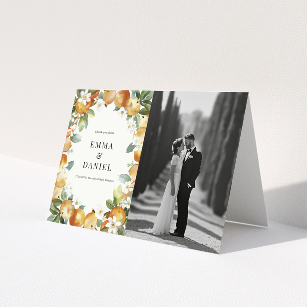 Wedding thank you card with floral design and one black and white wedding photo.
