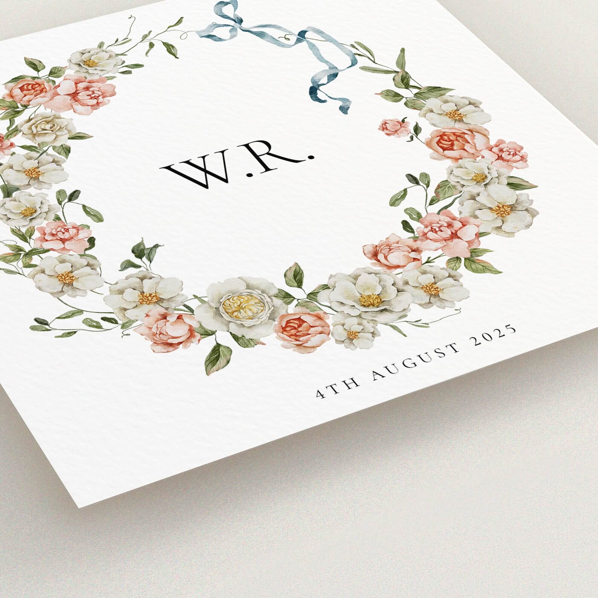 Floral christening invitation design with elegant wreath and ribbon decoration.