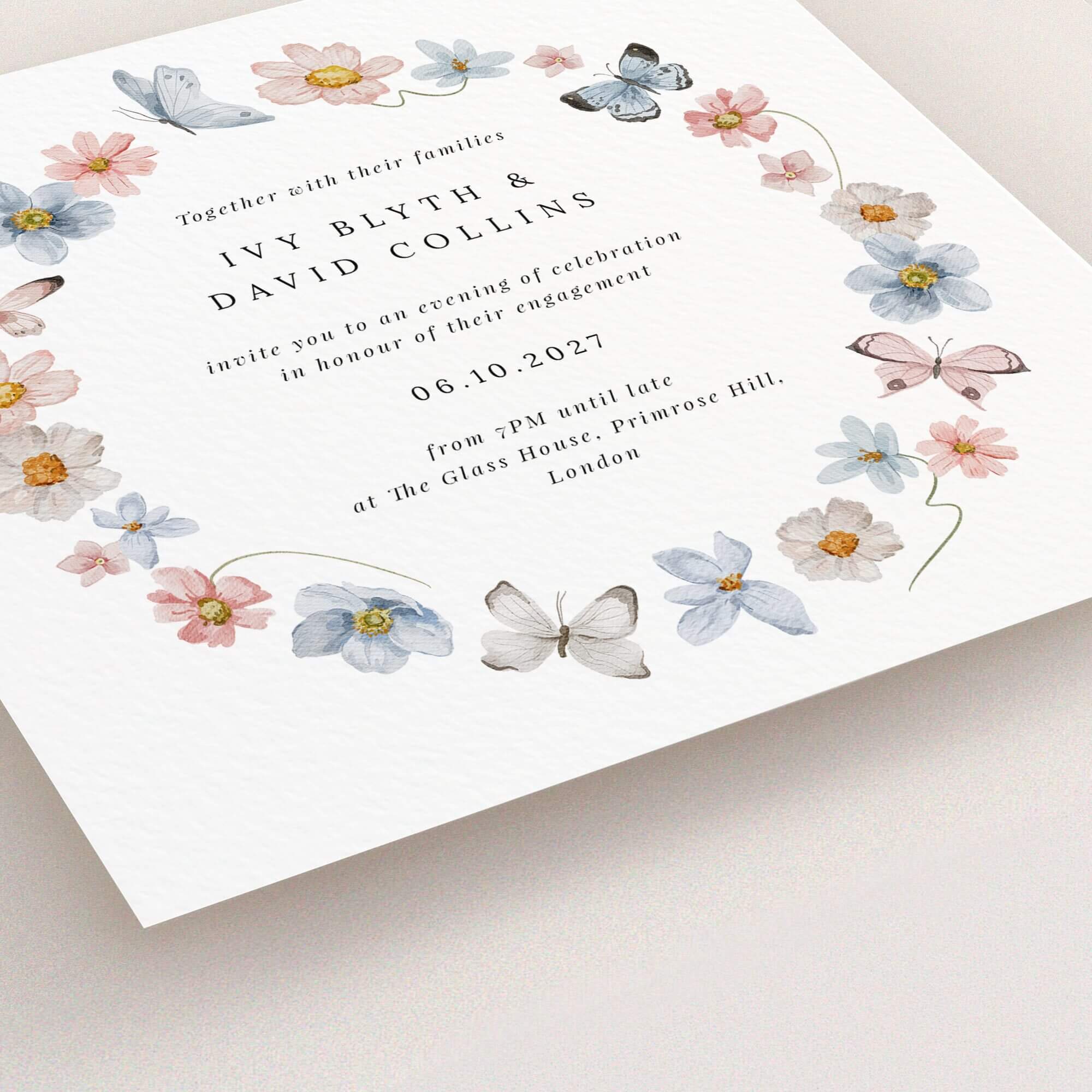 Floral wreath design engagement party invitations with butterfly and flower illustrations.