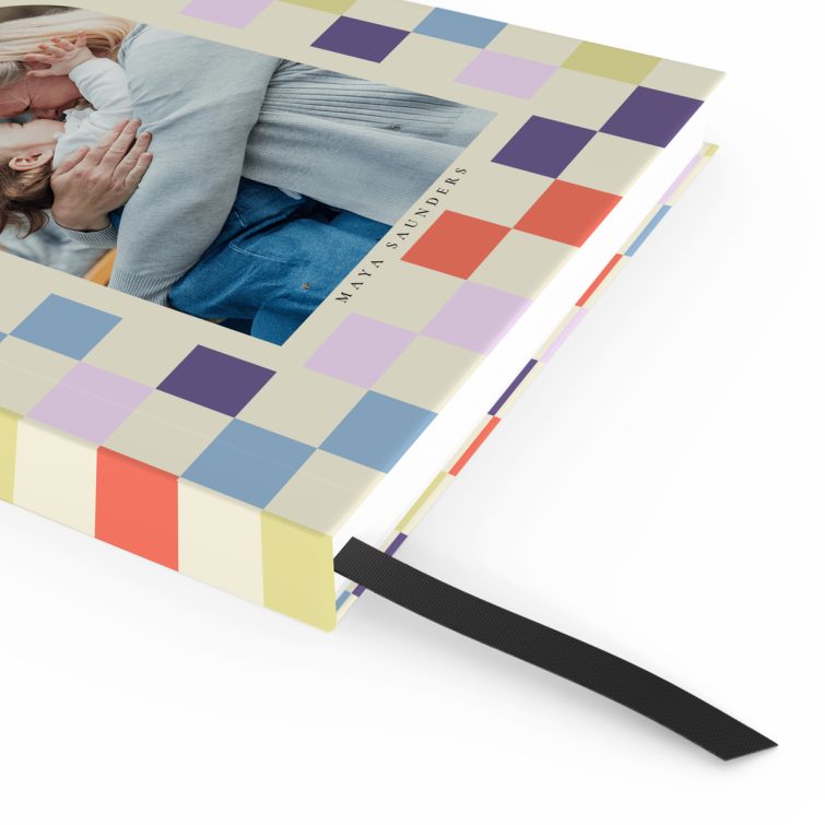 Colourful personalised notebook cover design with grid pattern, featuring one photo placeholder on the front cover.