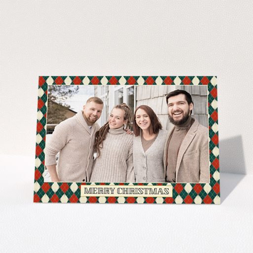 A personalised christmas card called "Argyle Chic". It is an A6 card in a landscape orientation. It is a photographic personalised christmas card with room for 1 photo. "Argyle Chic" is available as a folded card, with tones of festive green and red.