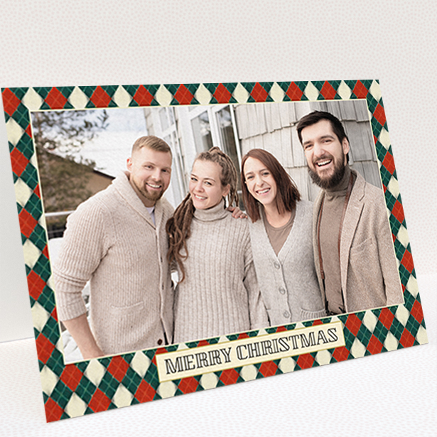 A personalised christmas card called "Argyle Chic". It is an A6 card in a landscape orientation. It is a photographic personalised christmas card with room for 1 photo. "Argyle Chic" is available as a folded card, with tones of festive green and red.