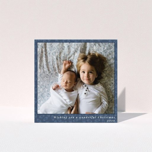 A personalised christmas card design titled "Baby, Its Cold Outside". It is a square (148mm x 148mm) card in a square orientation. It is a photographic personalised christmas card with room for 1 photo. "Baby, Its Cold Outside" is available as a folded card, with mainly blue colouring.