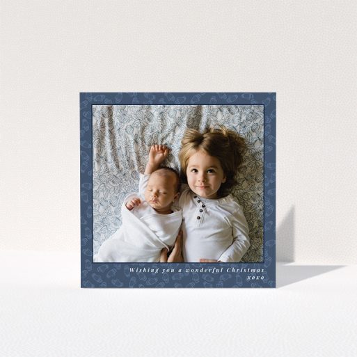 A personalised christmas card design titled "Baby, Its Cold Outside". It is a square (148mm x 148mm) card in a square orientation. It is a photographic personalised christmas card with room for 1 photo. "Baby, Its Cold Outside" is available as a folded card, with mainly blue colouring.