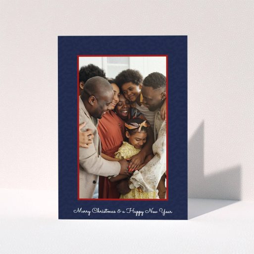 A personalised christmas card called "Blue and Red". It is an A6 card in a portrait orientation. It is a photographic personalised christmas card with room for 1 photo. "Blue and Red" is available as a folded card, with tones of red and blue.