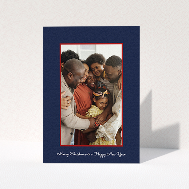 A personalised christmas card called "Blue and Red". It is an A6 card in a portrait orientation. It is a photographic personalised christmas card with room for 1 photo. "Blue and Red" is available as a folded card, with tones of red and blue.